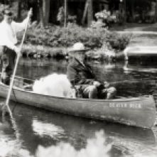 Beaver Dick Canoe President Calvin Coolidge fishing at Cedar Island Lodge, rustic lodge of Henry C. Pierce, 35 miles from Superior, Wisconsin, on the Brule River. Guide John LaRock