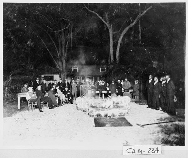 The Coolidges at Cabin Bluff enjoying an old-fashioned oyster roast around the fire. The President and Mrs. Coolidge are seated in the front row on the left (Grace is third from left, Calvin sits on the far right end). 