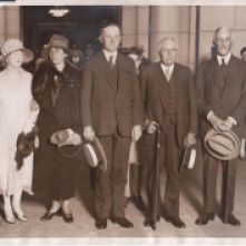 President Coolidge stands beside two of his greatest partners in policy: Secretary Frank B. Kellogg in foreign affairs and Secretary Andrew W. Mellon in domestic business, particularly tax policy.