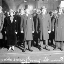 The Coolidges are standing with Oscar Bradfute, to the President's left, in a picture taken in Chicago before Coolidge's address.