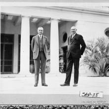 Calvin Coolidge and his friend and host, entrepreneur Howard E. Coffin, as they walk the terrace of "The Big House" built by Thomas Spalding, 1810, Sapelo Island.