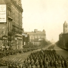 View down Pennsylvania Avenue with the Capitol in the background, as a wide variety of America's servicemen march in honor of President Coolidge's inauguration.