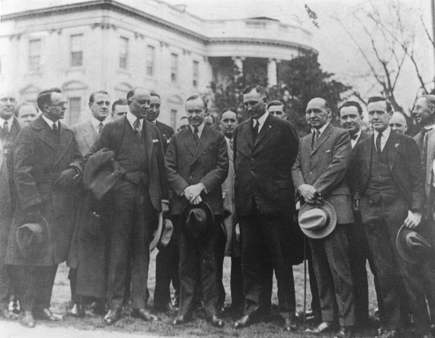 President Coolidge surrounded by members of the American Legion, led by John Quinn, pressuring for the Veterans' Bonus Bill, what would become the World War Adjusted Compensation Act passed by Congress over the President's veto, May 1924. Coolidge firmly disagreed with direct compensation levied upon the rest of the people. As he declared, "patriotism...bought and paid for is not patriotism." 
