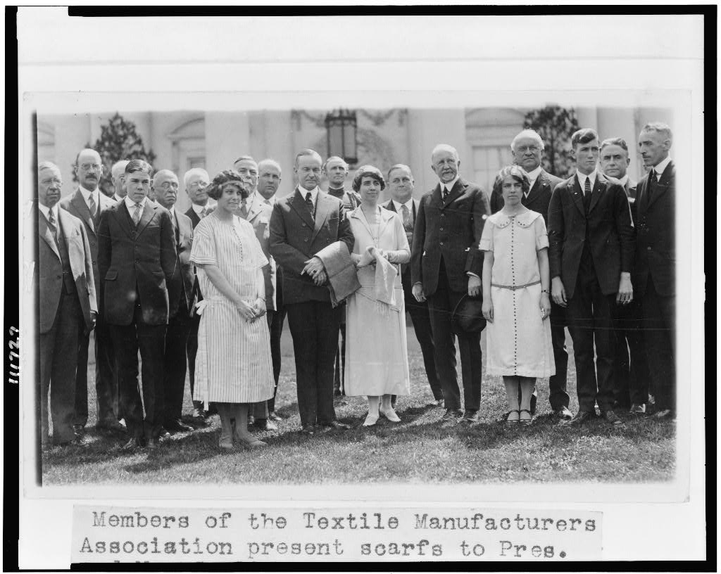 Members of the Textile Manufacturers Association presenting scarfs to the Coolidges on the White House lawn, 1925. Courtesy of the Library of Congress. 