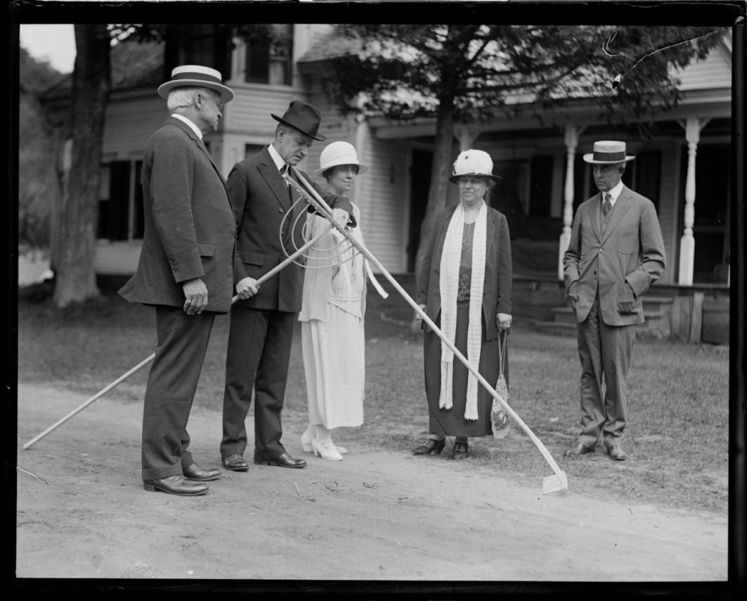 President Coolidge examines the quality of the craftsmanship. 
