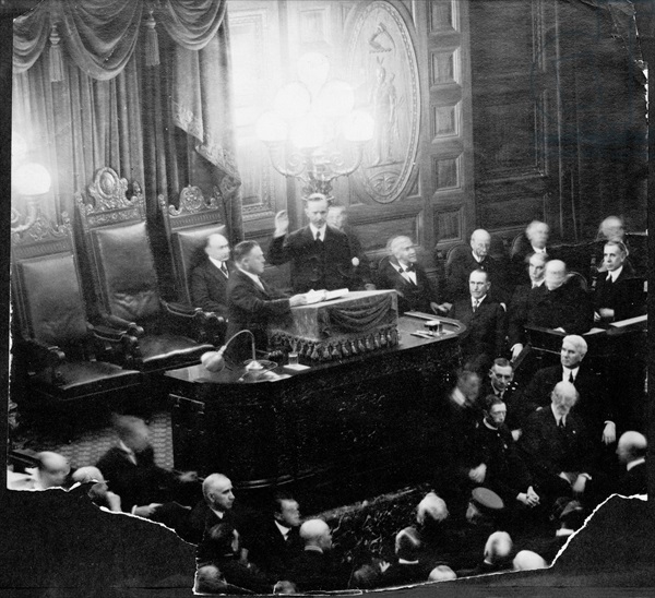 Calvin Coolidge (1873-1933) taking the oath of office as Governor of the State Senate, 1st January 1919 (b/w photo)