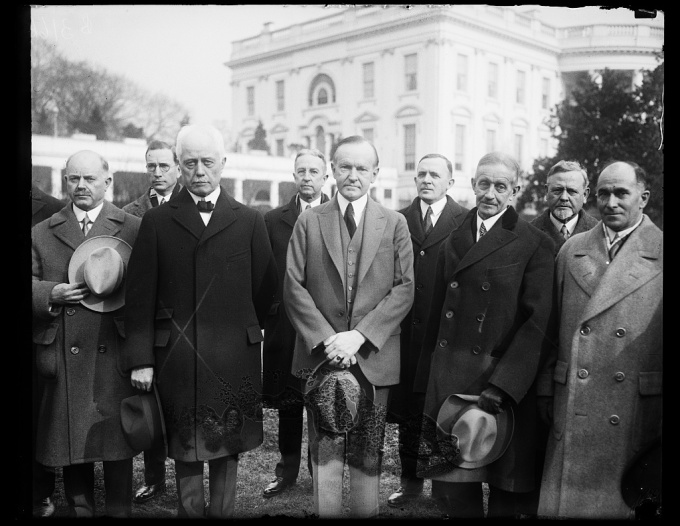 In the center of the photograph left to right Secretary of Commerce Whiting President Coolidge and George R. Putnam Commissioner of Lighthouses 1-17-1929