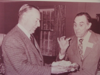 John Coolidge, the President's son, offering samples of his cheese to a visiting Swiss delegation.