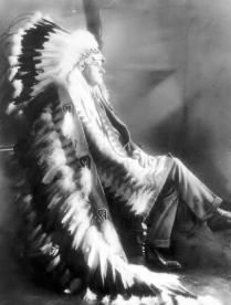 (NYT2) UNDATED -- Dec. 27, 1997 -- COOLIDGE-LEGACY, 12-27 -- President Calvin Coolidge, wearing a gift, a Sioux headdress. Historians will gather in July to reconsider the legacy of President Calvin Coolidge. For years, the view of Coolidge as a bloodless, distant president has prevailed. 'He came into the White House a pathological case: cruel, frigid, distrustful, sour, loathing people and human contact,' Irving Stone wrote in 'They Also Ran' in 1966. (New York Times Photo)