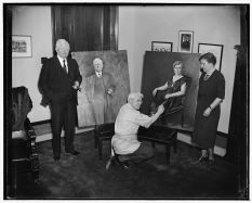 The artist later in life displaying his portraits of Vice President and Mrs. Garner.
