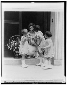 1927 April 30 Nan Norton - Elizabeth Ann Taylor, and Margaret Cooley present Mrs. Coolidge with basket of flowers as part of ceremonies for May Day is child health day.