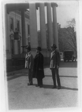 President Coolidge inspecting work being done at the White House. Col E. Sterling, Pres. Coolidge and Col. Cheney, military aide to the president 3-10-1927