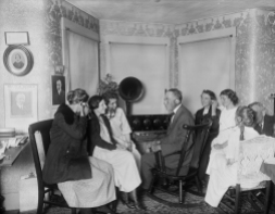ca. 1923, Plymouth, Vermont, USA --- John Coolidge, the father of President Calvin Coolidge, listens to his son's acceptance speech over the radio. With Mr. Coolidge are (from left to right): Mrs. Guy Mayo, Verna Mayo, Florence Cilley, Colonel Coolidge, Flora Smith, Ruth Aldrich, Aurora Peirce, and John Reed. --- Image by © Bettmann/CORBIS