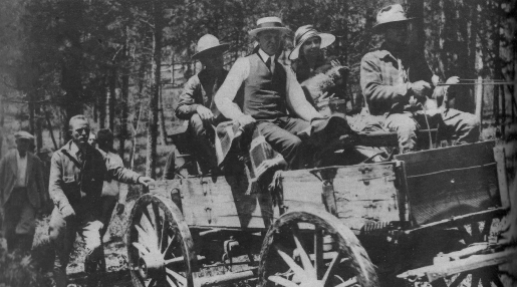 The Coolidges on a wagon in South Dakota.