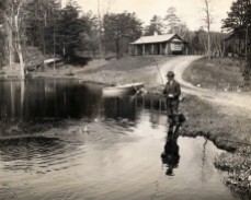 ca. 1922-1929, Simsbury, Connecticut, USA --- Original caption: Connecticut: President Calvin Coolidge fishing at the home of George McLean in Simsbury, Connecticut. --- Image by © Bettmann/CORBIS