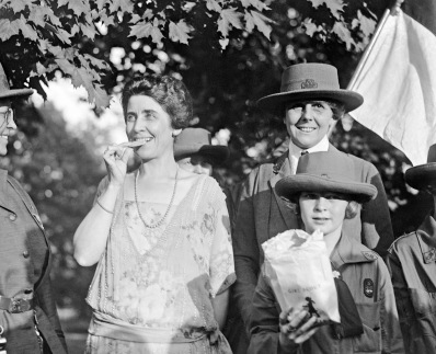 Mrs. Coolidge eating Girl Scout cookies 1923
