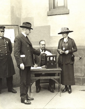 The Coolidges cast their votes, 1920.