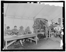 Soldiers visiting a YMCA library tent.